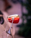 Vertical shot of a vintage vehicle's side mirror reflecting the light Royalty Free Stock Photo