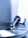 Vertical shot of a vinyl record on a turntable deck