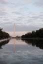 Vertical shot of the Washington Monument reflecting on a pool on a cloudy day Royalty Free Stock Photo