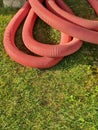 Vertical shot of water stack pipes laying on each other