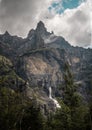 Vertical shot of a waterfall in Cirque Du Fer A Cheval at Alpes