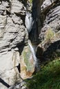 Vertical shot of a waterfall in Leukerbad Royalty Free Stock Photo