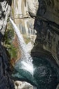 Vertical shot of a waterfall in Leukerbad Royalty Free Stock Photo