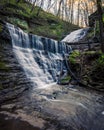 Vertical shot of a waterfall surrounded by trees and rocks, Jackson Falls, Tennessee, United States Royalty Free Stock Photo