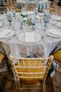 Vertical shot of a wedding table and chairs with floral decorations Royalty Free Stock Photo