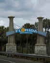 Vertical shot of the Welcome to Florida Sign on Tourist attraction in Florida under a gray sky Royalty Free Stock Photo