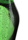 Vertical shot of a wet green bottle of wine isolated on white background Royalty Free Stock Photo