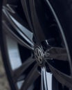 Vertical shot of the wheel of a Volkswagen Arteon gold color