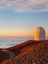 Vertical shot of the white building of Mauna Kea Observatories against a gorgeous gradient sunset Royalty Free Stock Photo