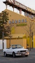 Vertical shot of a white classic BMW convertible in a parking lot Royalty Free Stock Photo