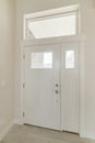 Vertical shot of a white front door of a house from the insid