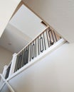 Vertical shot of a white neat interior design and stairs