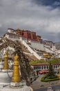 Vertical shot of a White Pagoda and Potala Palace in Lhasa, Tibet,China