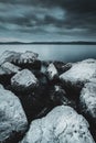 Vertical shot of white rocks on the beach on a cloudy day Royalty Free Stock Photo