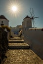 Vertical shot of a windmill against a blue sky Royalty Free Stock Photo