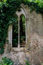 Vertical shot of a window of an ancient castle Royalty Free Stock Photo