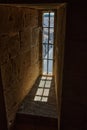 Vertical shot of a window in a castle in Aigues-Mortes, Gard, France Royalty Free Stock Photo