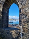 Vertical shot of a window from the McCaig Tower in Oban Bay, Scotland