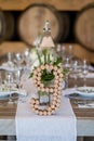 Vertical shot of wine cork number art on a wedding table
