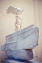 Vertical shot of the Winged Victory of Samothrace. Louvre Museum, Paris, France. Royalty Free Stock Photo