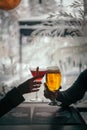 Vertical shot of a woman and man with glasses of cocktail and beer