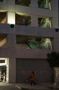Vertical shot of a woman passing a parking garage in Glendale