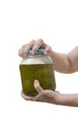 WomanÃ¢â¬â¢s Hands Trying To Open Pickle Jar On White