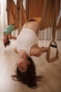 Women practicing fly yoga at sport studio