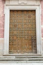 Vertical shot of a wooden door of the Cathedral of Toledo, Spain Royalty Free Stock Photo