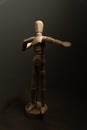 Vertical shot of a wooden figure of a human