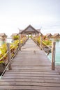 Vertical shot of a wooden path to the overwater bungalows in Kapalai Resort in Malaysia