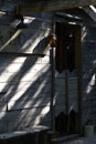 Vertical shot of a wooden saloon with sunlight reflections