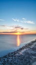 Vertical shot of the Worthing Beach at sunset in Worthing, England Royalty Free Stock Photo