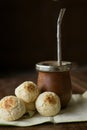 Vertical shot of Yerba mate and chipa cheese bread on the table