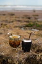 Vertical shot of yerba mate gourd cups on rocks