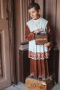 Vertical shot of a young boy statue symbolizing the act of almsgiving and virtue