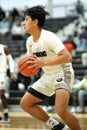 Vertical shot of a young male player on the court at a fall Indiana high school basketball game Royalty Free Stock Photo