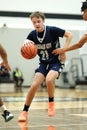 Vertical shot of a young male player on the court at a fall Merrillville high school basketball game Royalty Free Stock Photo