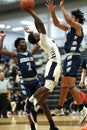Vertical shot of young male players on the court at a fall Merrillville high school basketball game Royalty Free Stock Photo