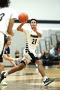 Vertical shot of young male players on the court at a fall Merrillville high school basketball game Royalty Free Stock Photo