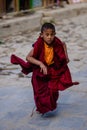 Vertical shot of a young Tibetan Buddhist Monk at the Tiji Festival in Lo Manthang Upper Mustang