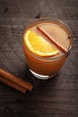 Vertical side point of view Mulled Wassail Cider with cinnamon sticks and orange slice Royalty Free Stock Photo