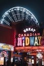 Vertical of a sign of Great Canadian Midway at night on Clifton Hill, Niagara Falls, Ontario, Canada Royalty Free Stock Photo