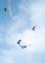Vertical of skydivers diving with a parachute from the cloudy sky Royalty Free Stock Photo