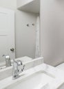 Vertical Small windowless white bathroom interior with shower tub combo kit