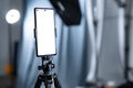 Vertical Smartphone Mockup on Tripod in Studio Royalty Free Stock Photo