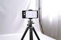 Vertical Smartphone Mockup on Tripod in Studio Royalty Free Stock Photo