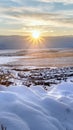 Vertical Snowed in hill overlooking frosted houses and lake in Draper Utah in winter