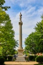 Vertical of soldier statue atop tall Greek pillar in Public Square park in downtown Mount Vernon