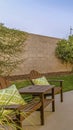 Vertical Spacious patio at the backyard of a home with a seating and dining area